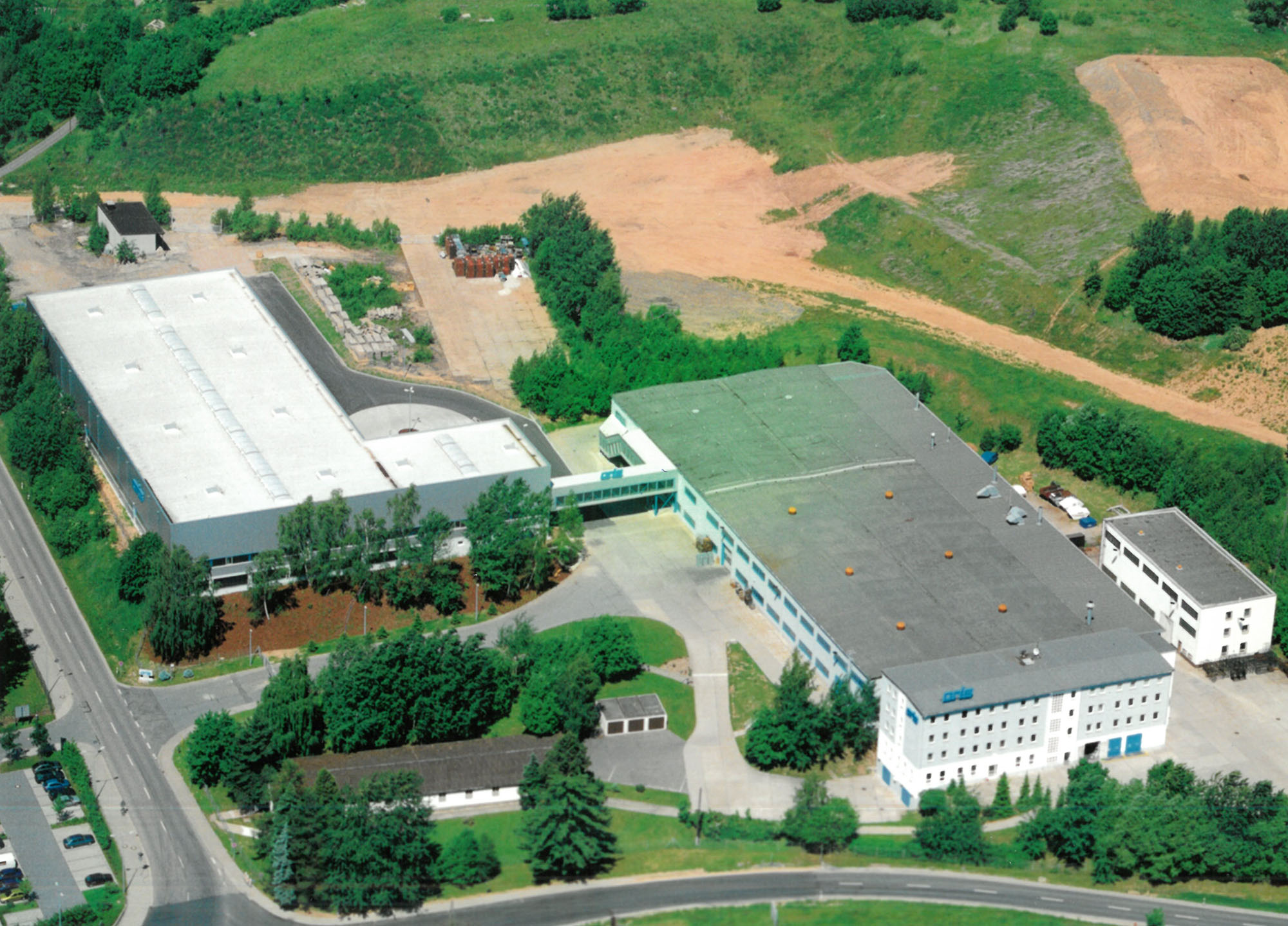 Aerial view of the ORIS production facility in St. Egidien, Germany, opened in 1989 and later becoming a key manufacturing site for ORIS swivel towbar systems.