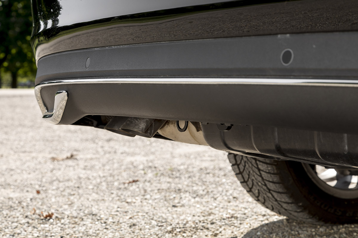 Close-up of a vehicle rear bumper with integrated mounting point for an ORIS vertically detachable towbar in removed position.