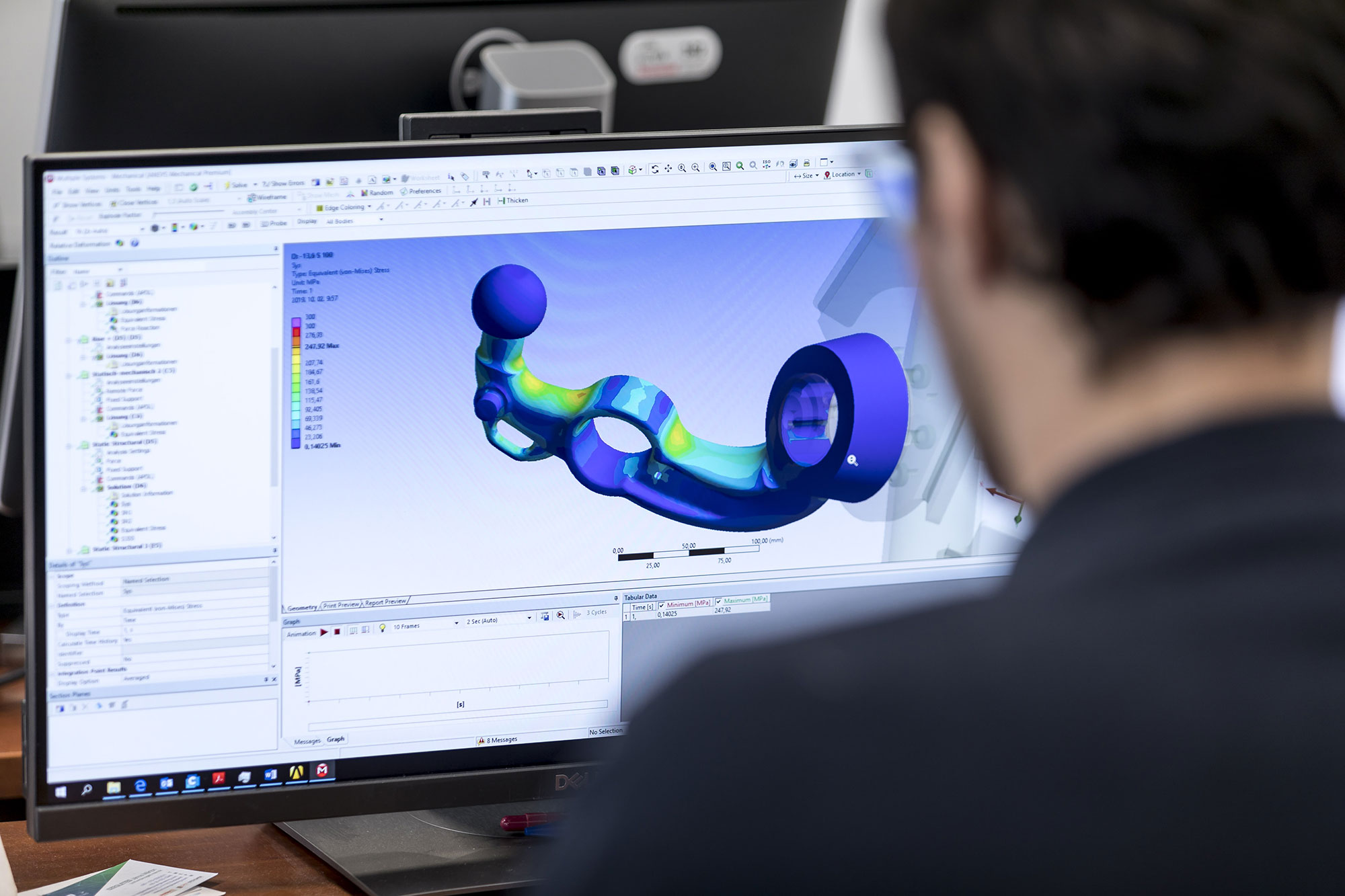Engineer analysing a digital stress simulation of an ORIS towbar in CAD software during product development and validation.