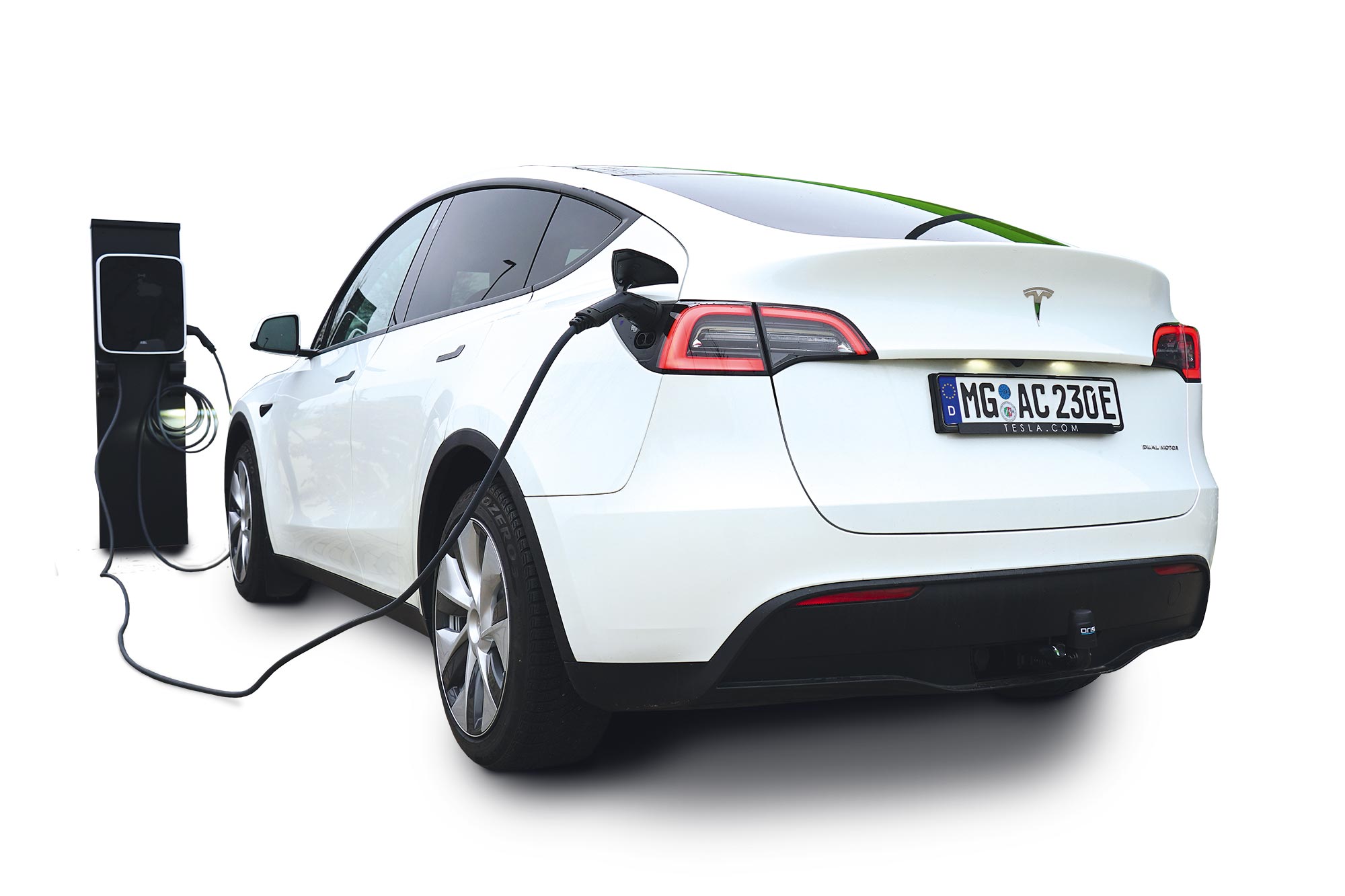 White Tesla charging at a charging station with ORIS AK41 FIX4BIKE® towbar installed.