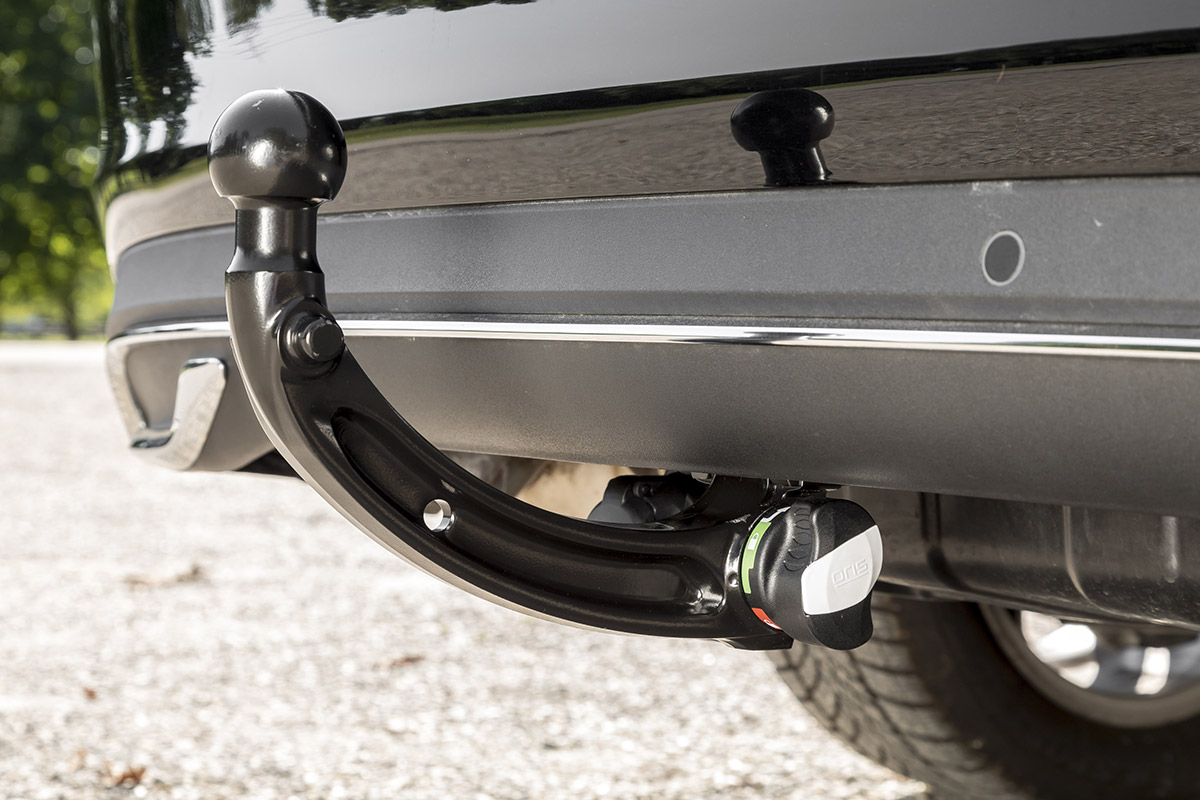 Close-up of an installed ORIS vertically detachable towbar mounted beneath a vehicle rear bumper.