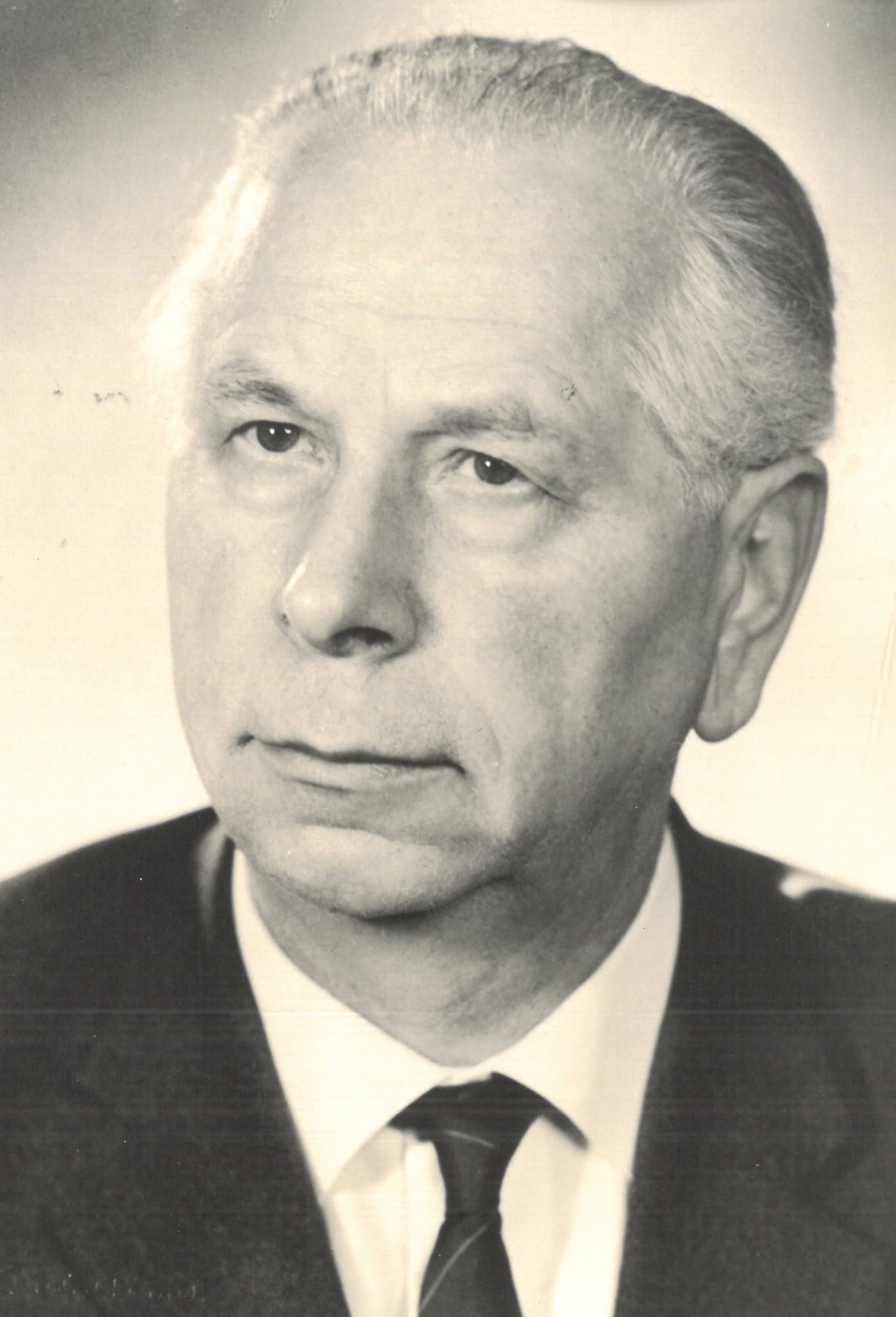 Black-and-white portrait of ORIS founder Otto Riehle wearing a suit and tie, shown in a formal head-and-shoulders photograph against a plain background.
