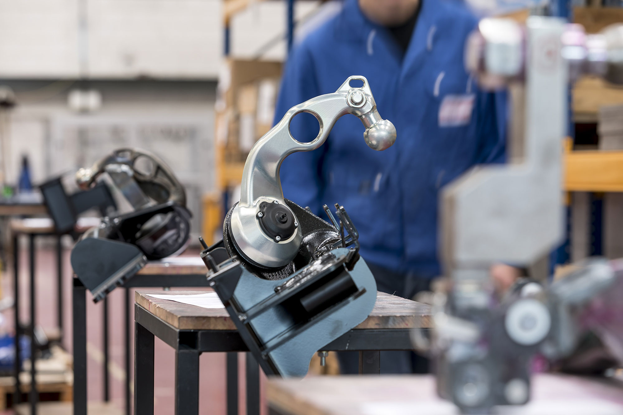 ORIS towbar coupling component undergoing quality inspection and testing in a manufacturing and assembly facility.